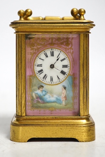 A miniature brass and enamel figurative panelled carriage timepiece, 7cm high. Condition - both gilt and enamel panels marked